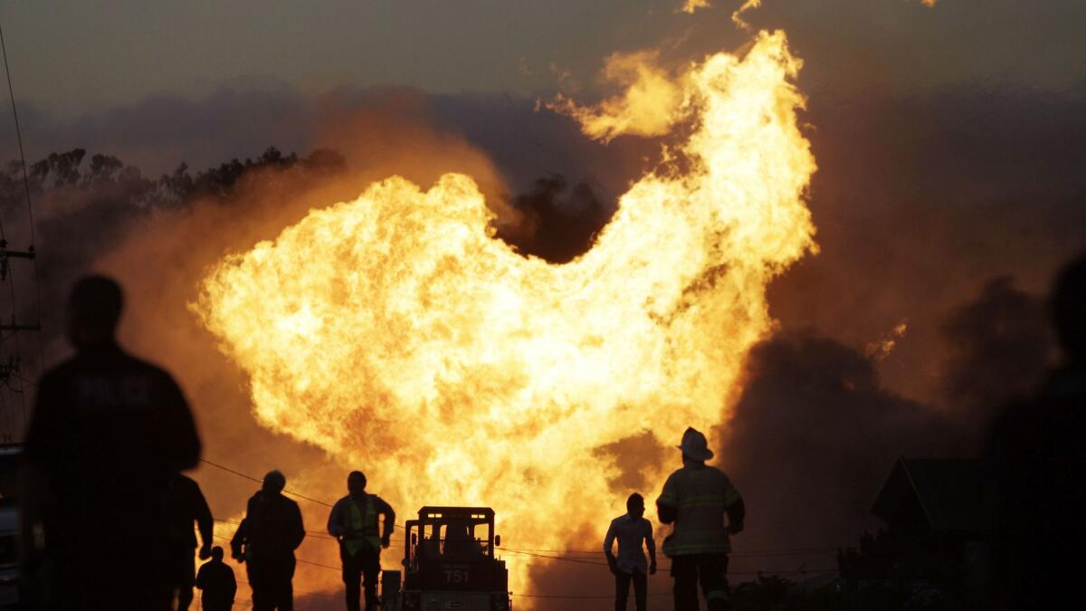 In this Sept. 9, 2010, file photo, a massive fire from a pipeline explosion roars through a neighborhood in San Bruno, Calif.