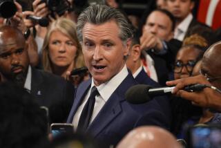 FILE - California Gov. Gavin Newsom speaks to reporters after a presidential debate between President Joe Biden and Republican presidential candidate former President Donald Trump in Atlanta, Thursday, June 27, 2024. On Saturday, June 29, 2024, Newsom signed California's budget to close an estimated $46.8 billion deficit through $16 billion in spending cuts and temporarily raising taxes on some businesses. (AP Photo/John Bazemore, File)