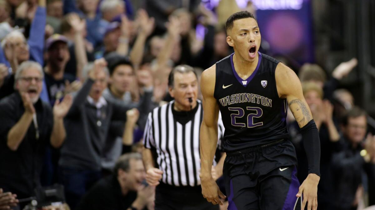 Washington's Dominic Green reacts after sinking a 3-point basket during the second half against Arizona.