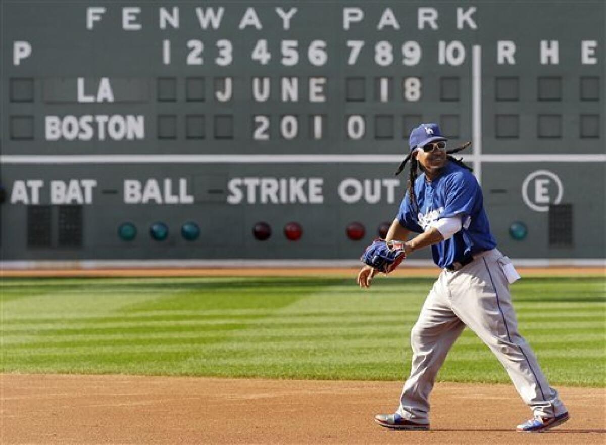 Boston Red Sox left fielder Manny Ramirez stretches before batting