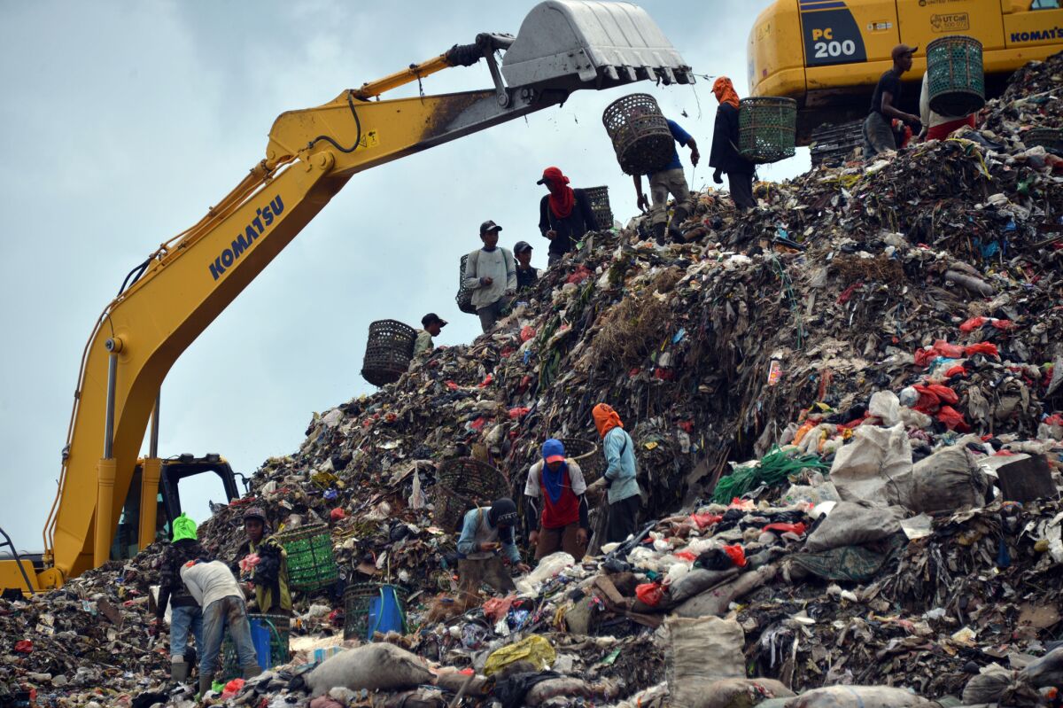 People search for material to recycle at the biggest garbage dump in Jakarta, the Indonesian capital.
