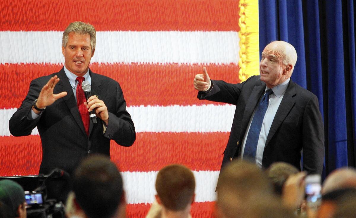 Sen. John McCain of Arizona, right, campaigns with Scott Brown in Derry, N.H. Brown, a Republican, is running for Senate in New Hampshire.
