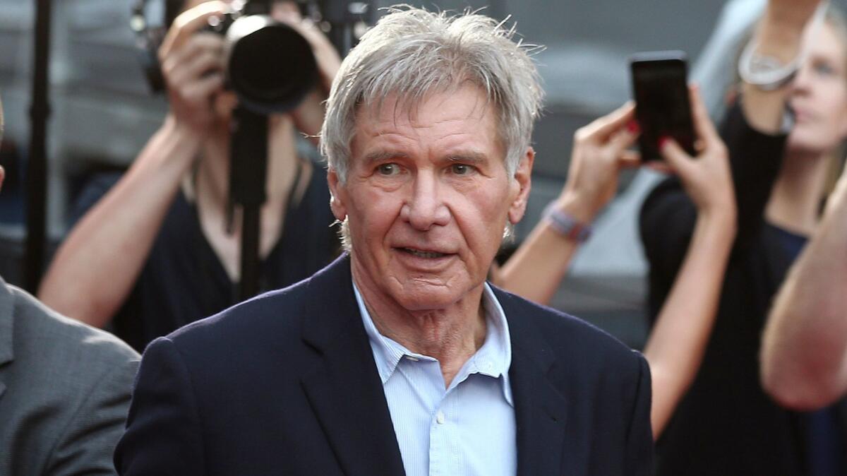 In this December 10, 2015 file photo, Harrison Ford greets fans during a Star Wars fan event in Sydney, Australia. (Rob Griffith / Associated Press)