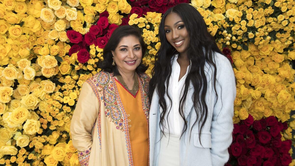 HFPA president Meher Tatna, left, with 2019 Golden Globe ambassador Isan Elba at the Jan. 3 event at the Beverly Hilton.