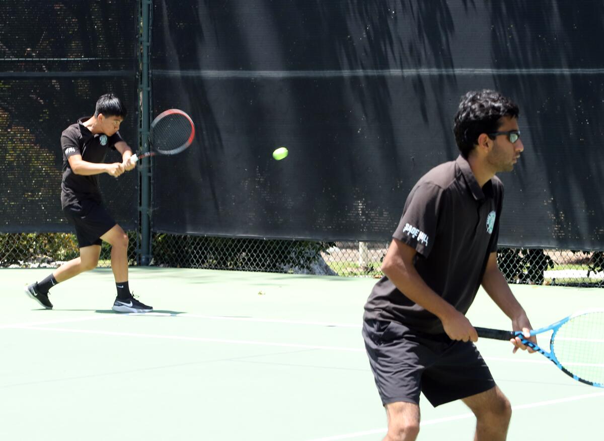 Sage Hill's No. 3 doubles team of Jimmy Chen, left, and Ali Rawal compate during Friday's CIF title match in Claremont.