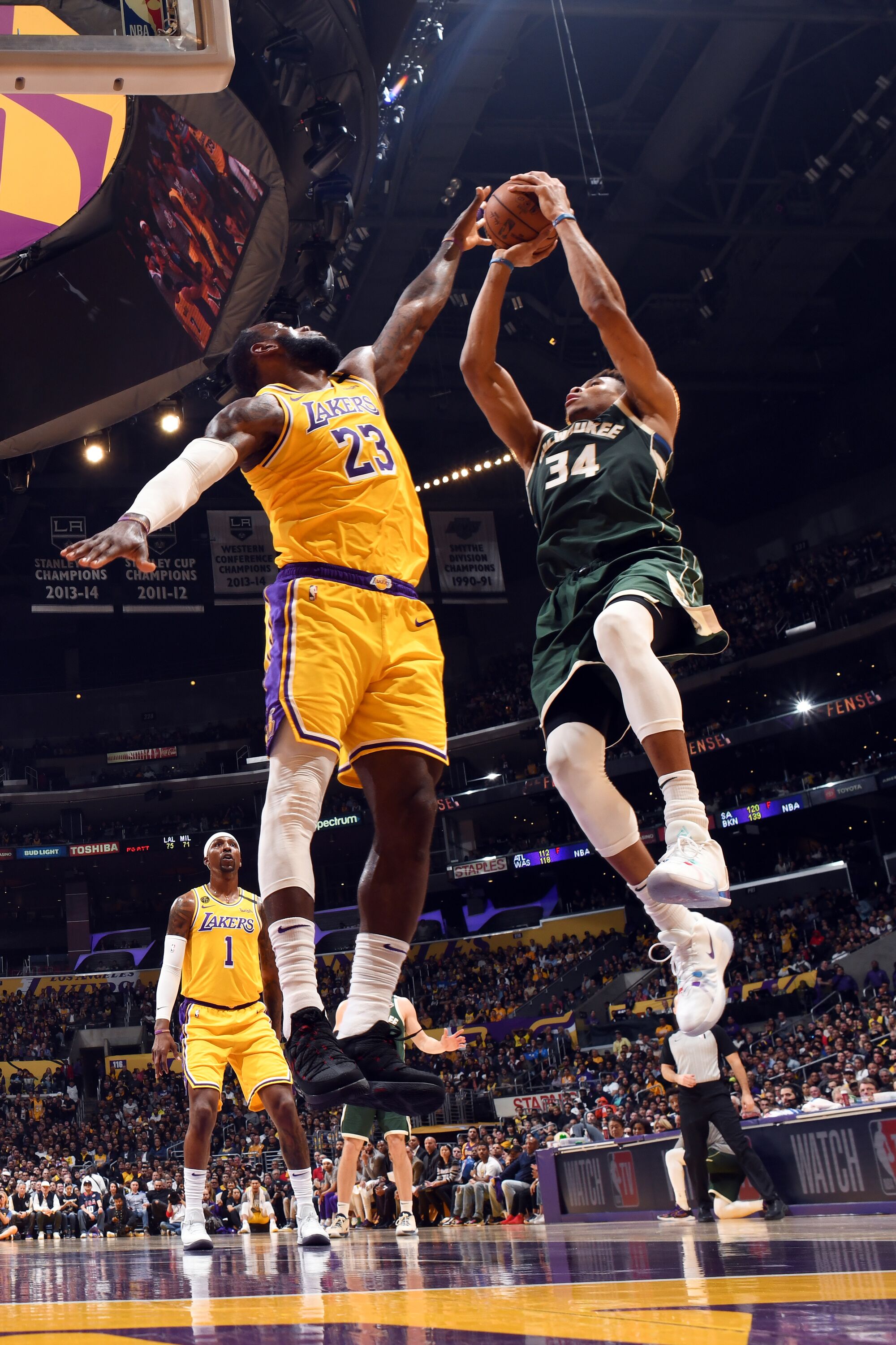 Lakers' LeBron James attempts to block a shot by Milwaukee Bucks' Giannis Antetokounmpo on March 6 at Staples Center.