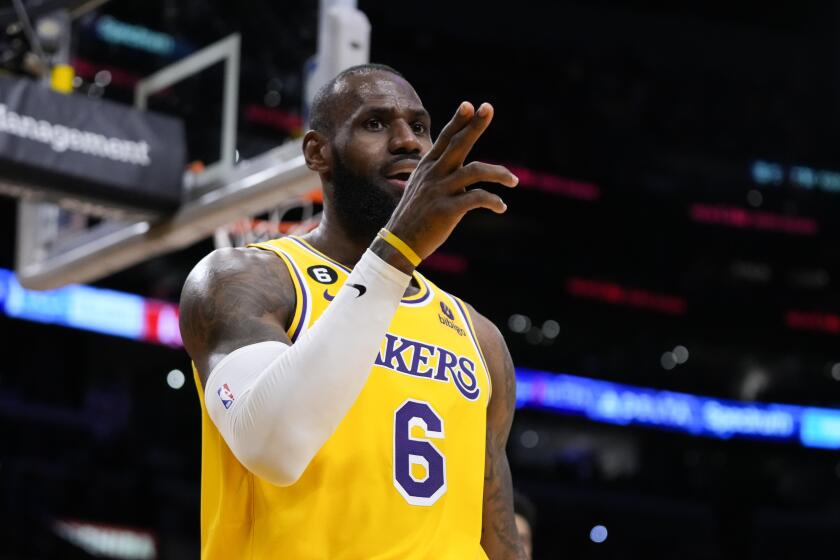 Los Angeles Lakers' LeBron James (6) reacts after making a basket and drawing a foul during the first half of an NBA basketball game against the Houston Rockets, Monday, Jan. 16, 2023, in Los Angeles. (AP Photo/Jae C. Hong)