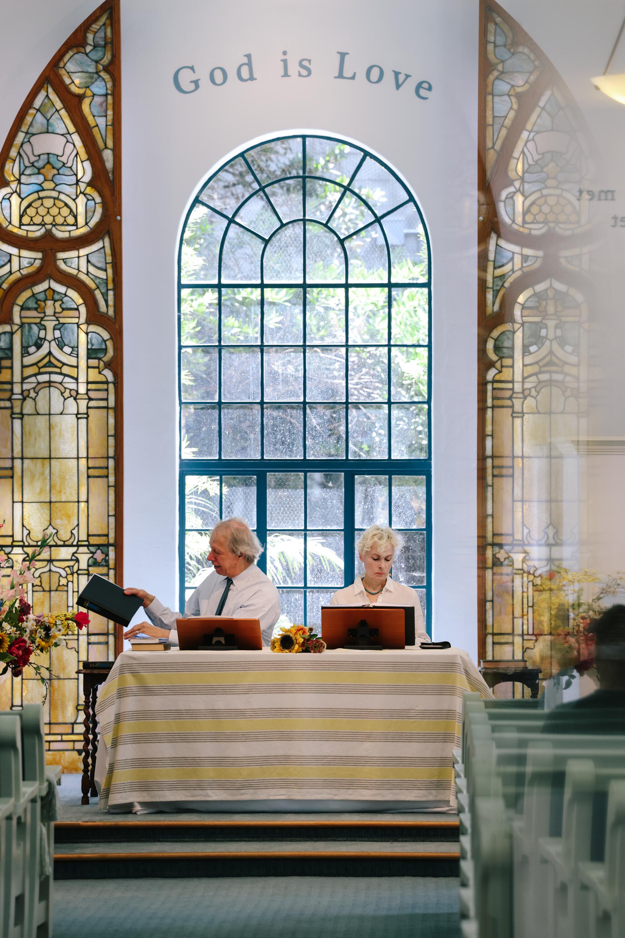 Jeffrey Taylor and Deborah Johnson read during service at the Third Church of Christ, Scientist of Los Angeles.