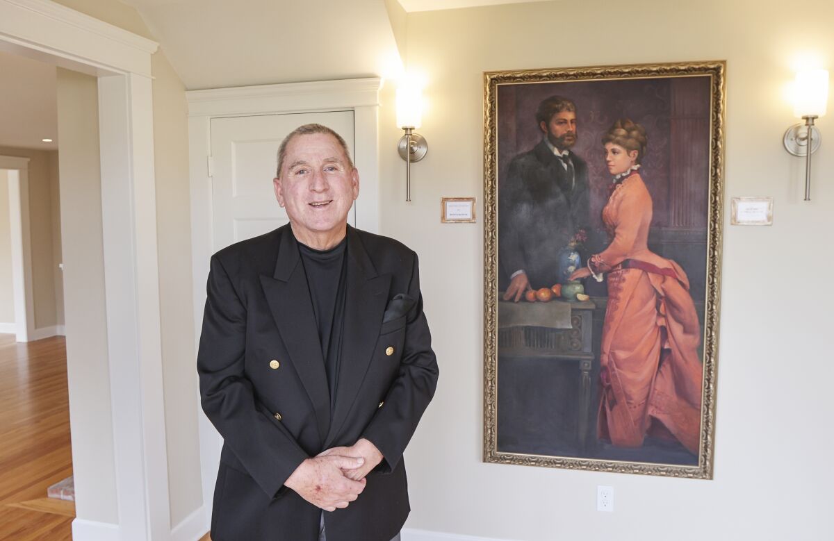 Developer Jeff Phair with a painting of Ulysses Grant Jr. and his wife.