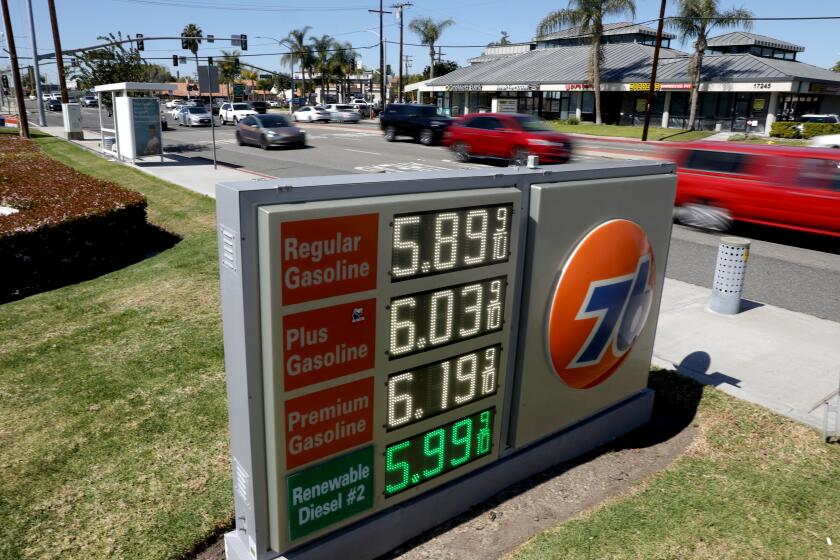 TUSTIN, CA - MARCH 08: An employee recently raised the prices of gas at the Union 76 station along 17th Street and Carroll on Tuesday, March 8, 2022 in Tustin, CA. The average price of a gallon of self-serve regular gasoline in Los Angeles County rose 8.9 cents today, its 30th record in 32 days. In Orange County average price rose 8.8 cents, its 29th record in 34 days. (Gary Coronado / Los Angeles Times)