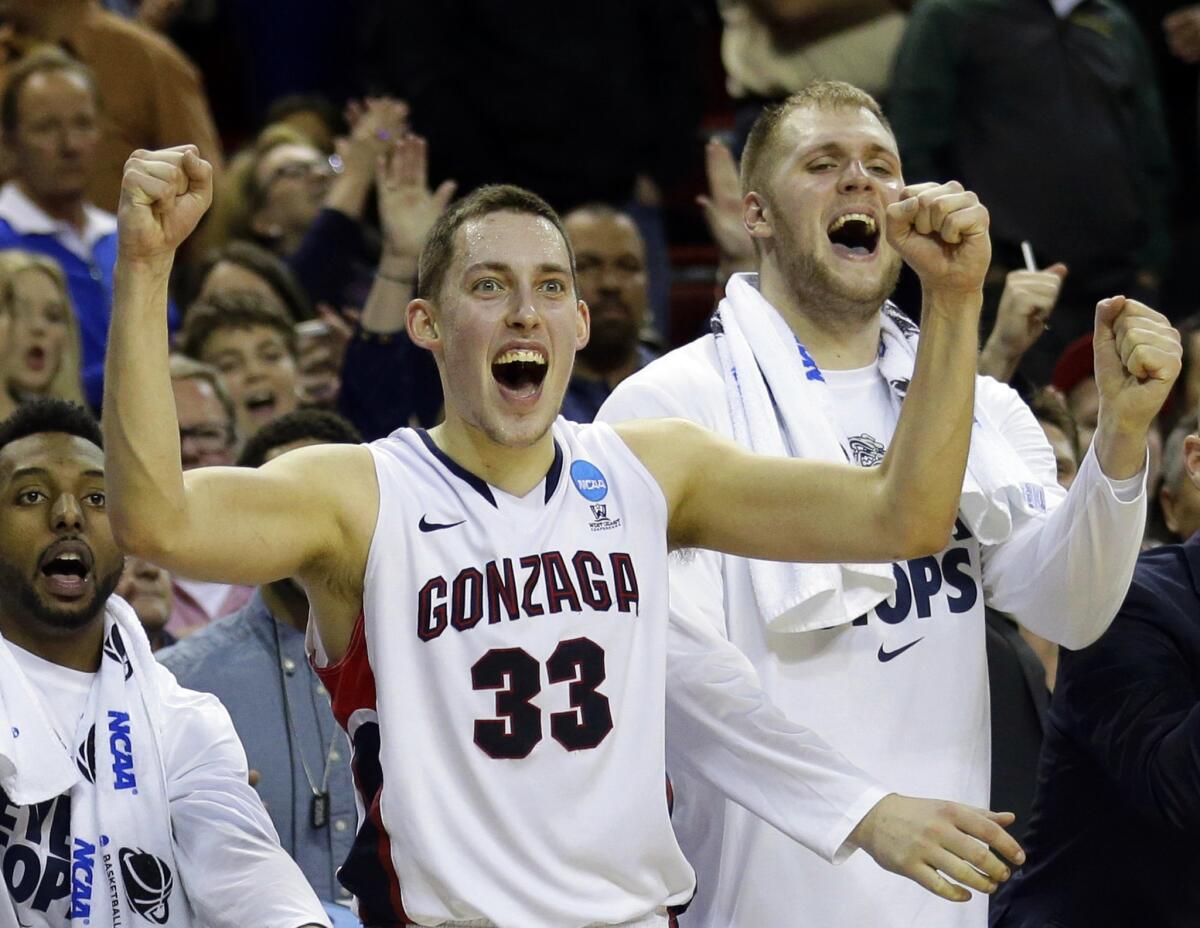 Gonzaga forward Kyle Wiltjer (33) and Przemek Karnowski, right, celebrate in the final seconds of the Bulldogs win over Iowa. Gonzaga next plays UCLA, who it defeated earlier this season.