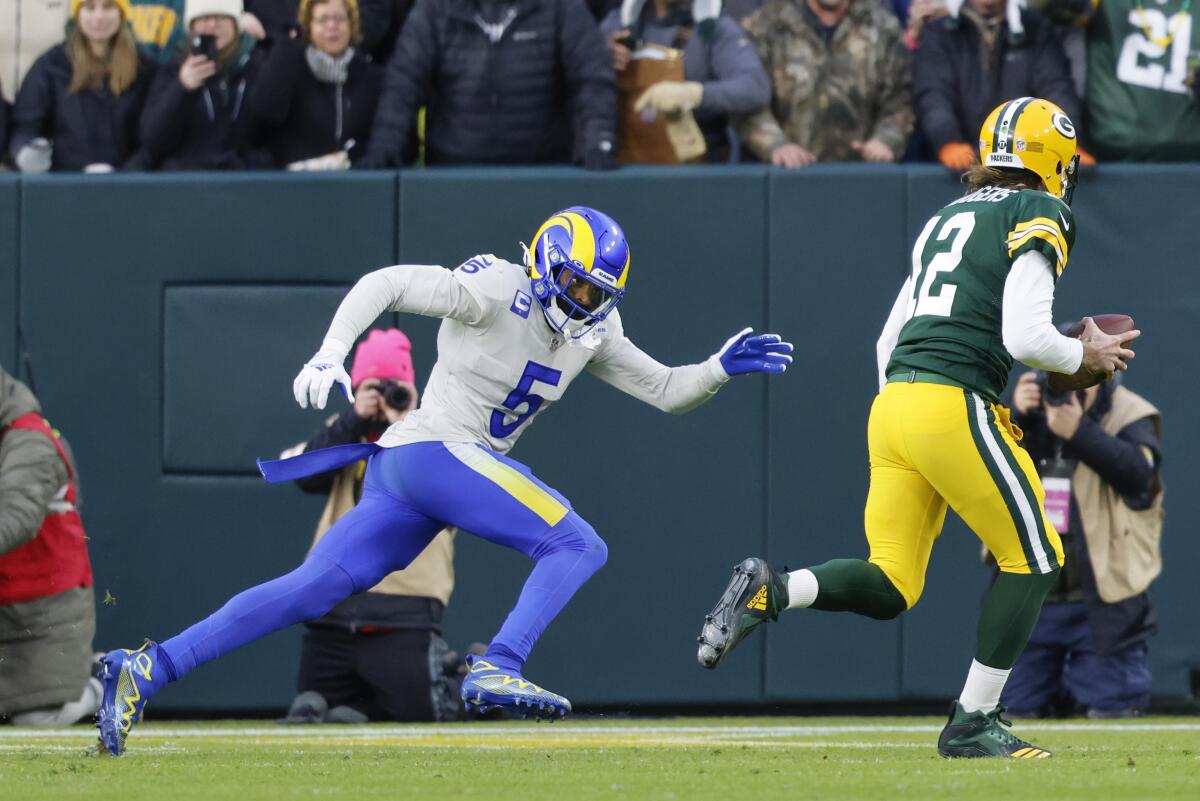 Rams cornerback Jalen Ramsey pursues Green Bay Packers quarterback Aaron Rodgers.