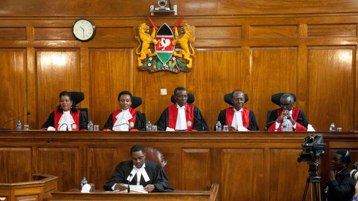 Kenyan Supreme Court judges, from left, Njoki Ndung'u, Deputy Chief Justice Philomela Mwilu, Chief Justice David Maraga, Jackton Ojwang and Isaac Lenaola prepare to deliver their reasons for invalidating the Aug. 8 presidential election. (Sayyid Abdul Azim / Associated Press)