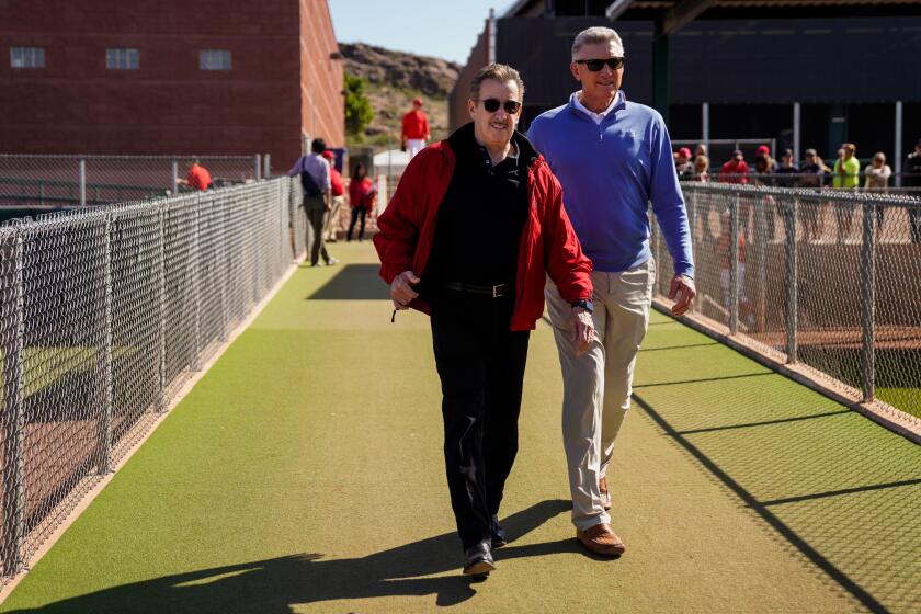 Angels owner Arte Moreno walks to the lower fields during Spring Training at Tempe Diablo Stadium