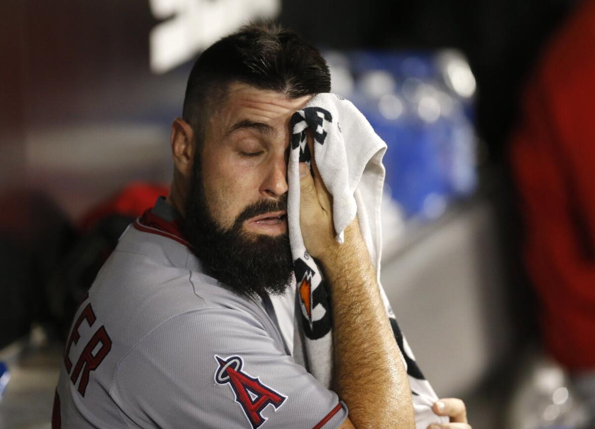 Angels starting pitcher Matt Shoemaker wipes his face after leaving a game against the Chicago White Sox earlier this month.