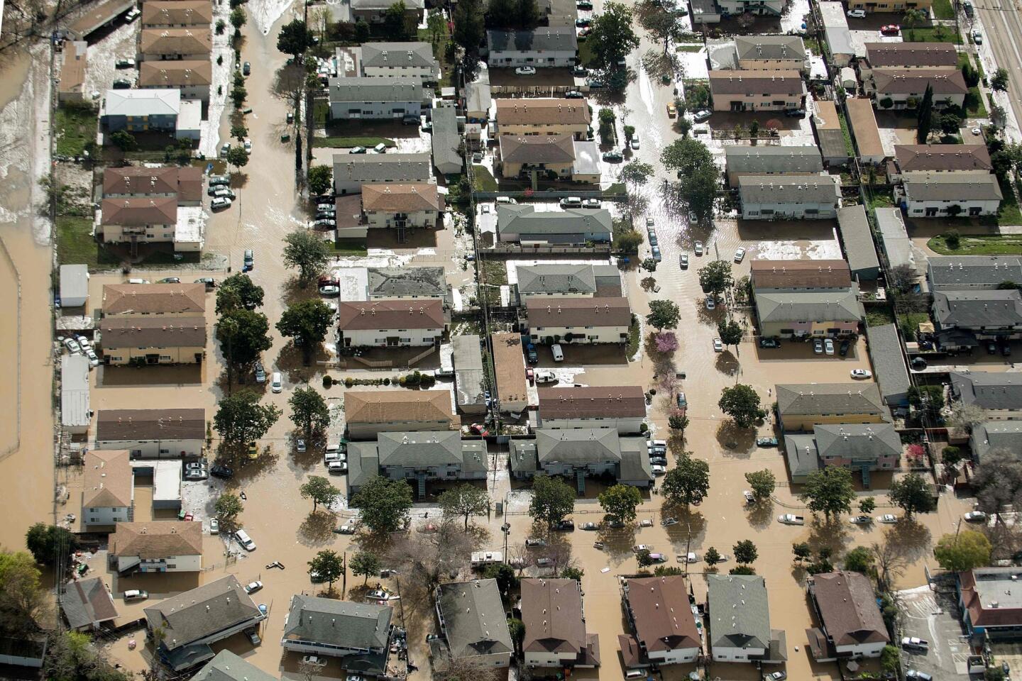 Floodwater surrounds homes in San Jose on Wednesday. Thousands of people were ordered to evacuate their homes as neighborhoods were inundated.