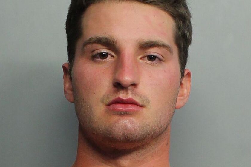 This booking image provided by the Miami-Dade Police Department shows Maxwell Berry, 22, of Norwalk, Ohio, who was arrested Saturday, July 21, 2021, at Miami International Airport and charged with three counts of misdemeanor battery, according to a Miami-Dade police report. Berry is accused of groping two female flight attendants and punching a male flight attendant during a flight from Philadelphia to Miami, officials said. (Miami-Dade Police Department via AP)