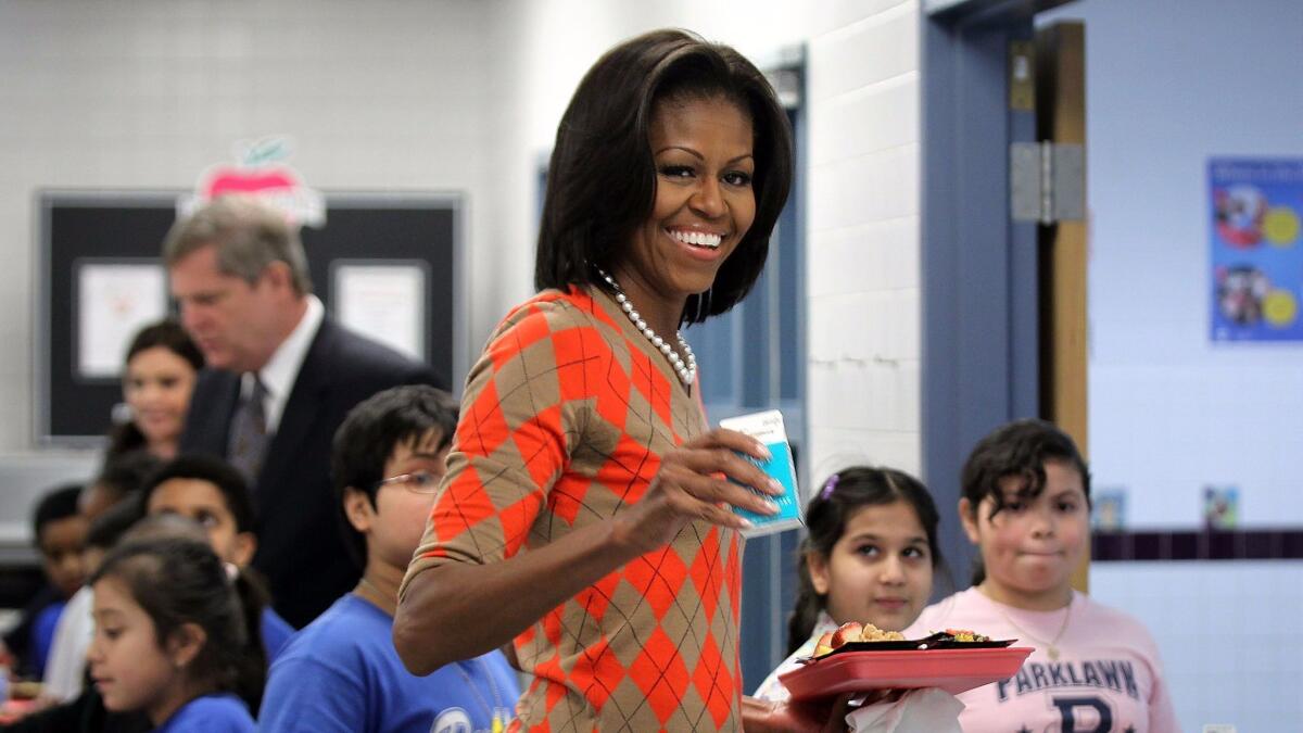Former First Lady Michelle Obama pushed for higher nutritional standards in school meals, including during this 2012 visit to Parklawn Elementary in Alexandria, Va.