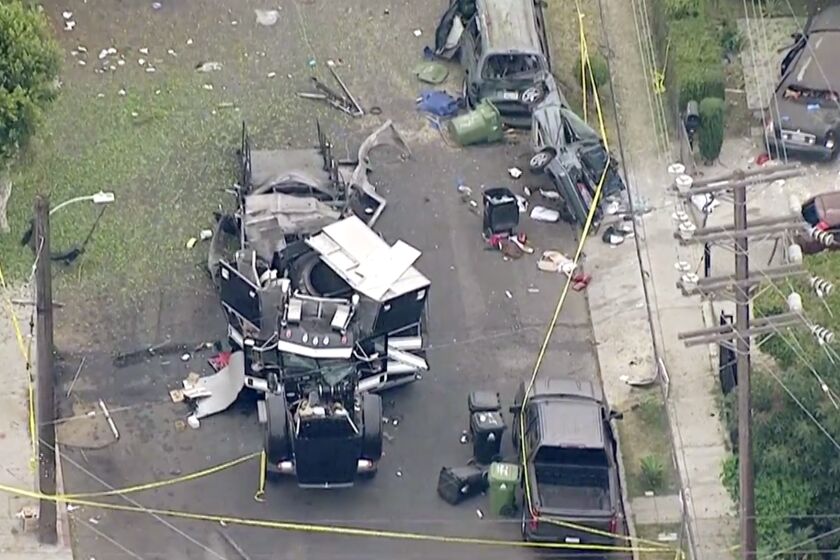 Aerial image shows the remains of an armored Los Angeles Police Department tractor-trailer after fireworks exploded Wednesday evening, June 30, 2021.