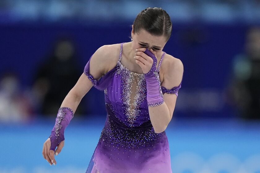 Kamila Valieva, of the Russian Olympic Committee, reacts in the women's short program during the figure skating at the 2022 Winter Olympics, Tuesday, Feb. 15, 2022, in Beijing. (AP Photo/David J. Phillip)
