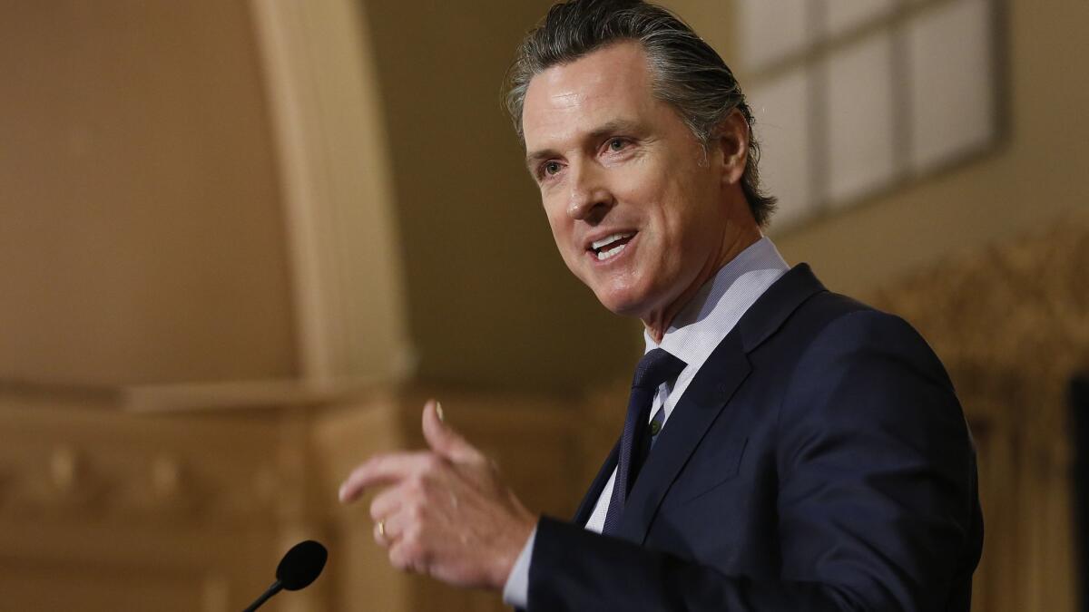 Gov. Gavin Newsom speaks at a breakfast in Sacramento last month. Newsom’s administration is using a new law in an attempt to force Huntington Beach to meet housing goals. The administration on Jan. 25 sued Surf City under the law that took effect Jan. 1.