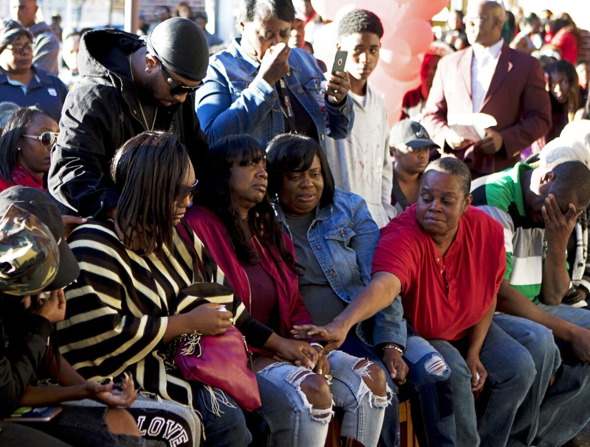 Family members of Grambling State University student Earl Andrews and his friend Monquiarious Caldwell, who was visiting from their hometown of Farmerville, attend a prayer vigil in honor of the two men, who were killed on campus in Grambling, La., Wednesday, Oct. 25, 2017.