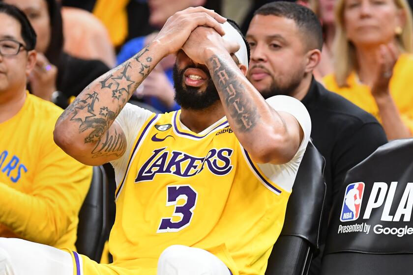 Lakers' Anthony Davis sits on the bench with an eye injury in the second half in Game 5 