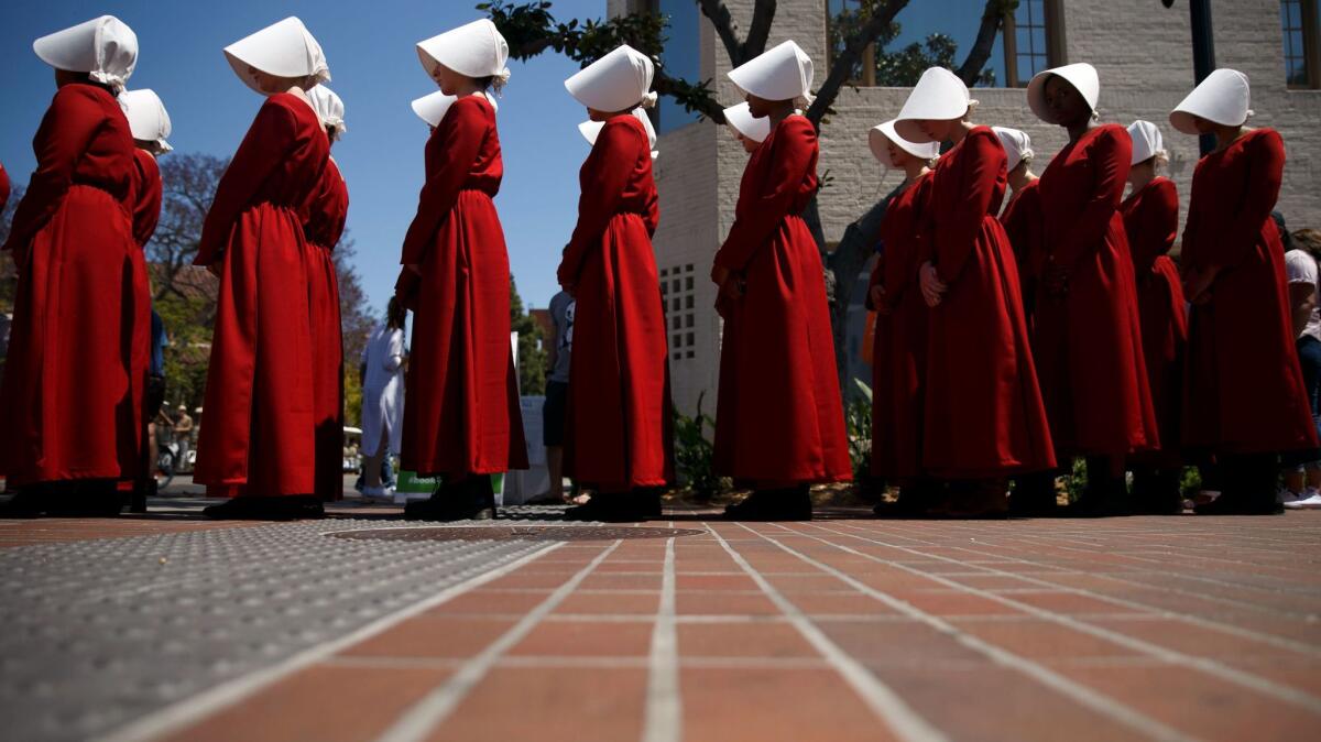 Handmaids from "The Handmaid's Tale," based on the book by Margaret Atwood, at the Los Angeles Times Festival of Books