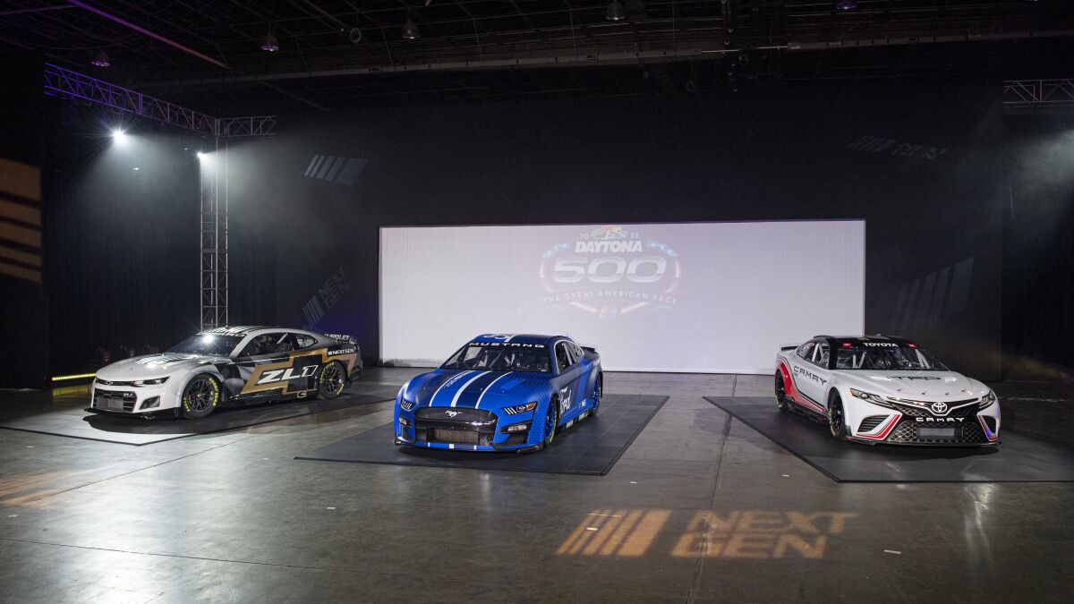 NASCAR unveils the Next Gen Cup cars for the 2022 season during the NASCAR media event in Charlotte, N.C., Wednesday, May 5, 2021. (AP Photo/Mike McCarn)