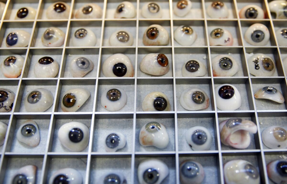 A collection of old artificial eyes in Stolpe's office in Tarzana. He's working on techniques to make eyes designed for affordability and widespread access.