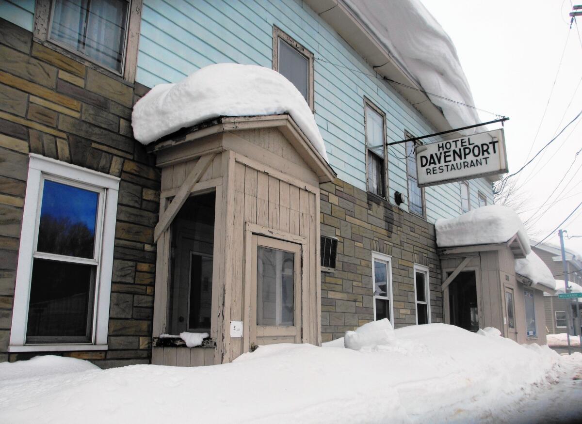 Layers of snow remain atop the roof of a hotel in Copenhagen, N.Y., ranked as the snowiest town in America. The temperature has rarely climbed above freezing this winter, making it nearly impossible for old snow to melt before new snow falls.