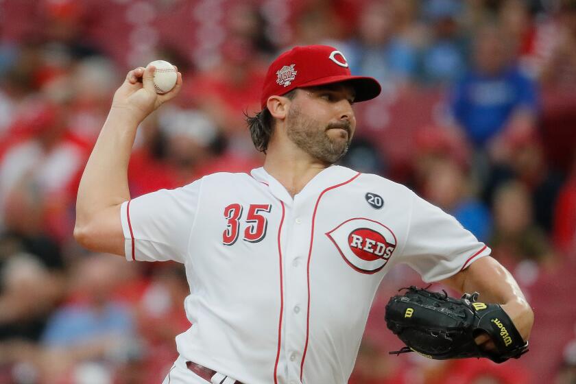Cincinnati Reds starting pitcher Tanner Roark throws in the second inning of a baseball game against the Pittsburgh Pirates, Tuesday, July 30, 2019, in Cincinnati. (AP Photo/John Minchillo)