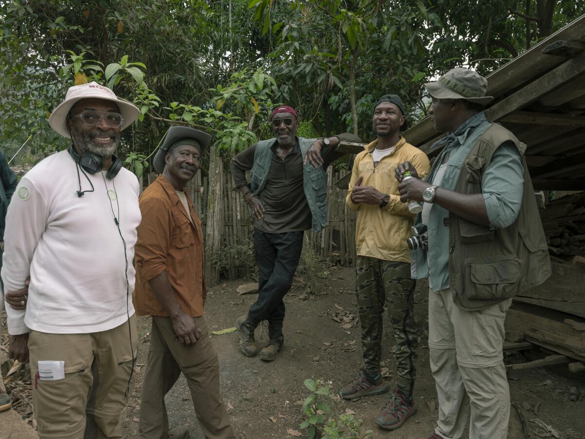 Director Spike Lee and the cast of "Da 5 Bloods" on set.