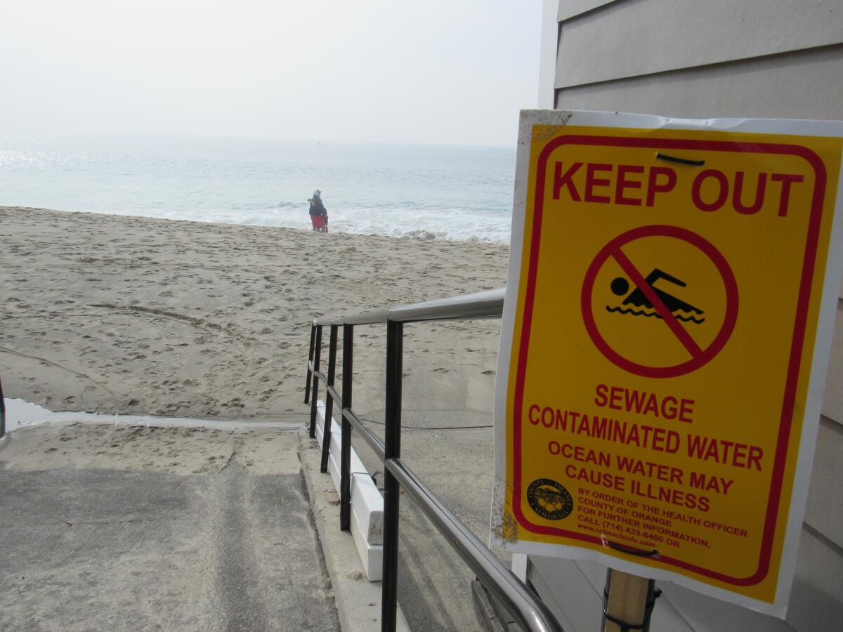 Signage advises the public to keep out of the water at Victoria Beach in Laguna Beach on Wednesday following a sewage spill.