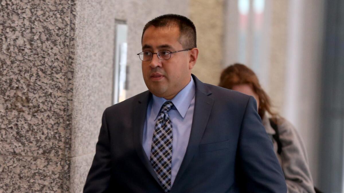 Chicago police Officer Marco Proano, 42, leaves the Dirksen U.S. Courthouse in Chicago on Monday.