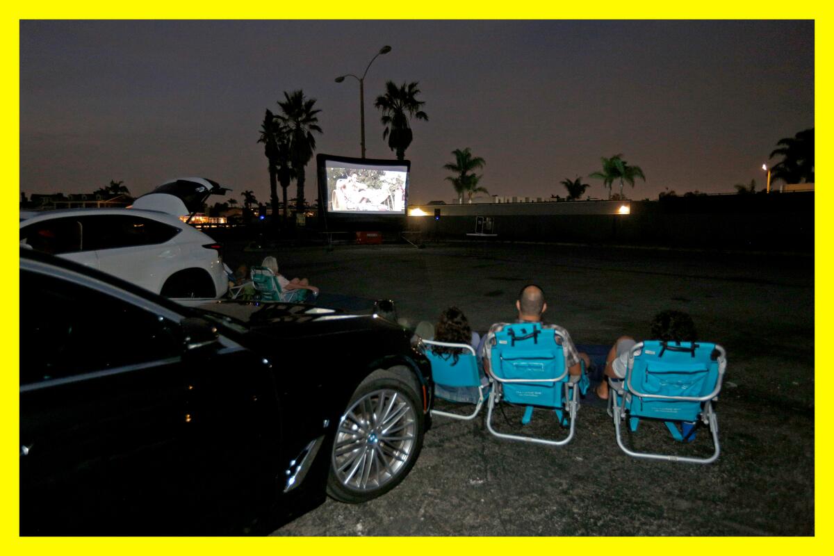 Moviegoers enjoy "Ferris Bueller's Day Off" at a temporary drive-in theater in Huntington Beach.