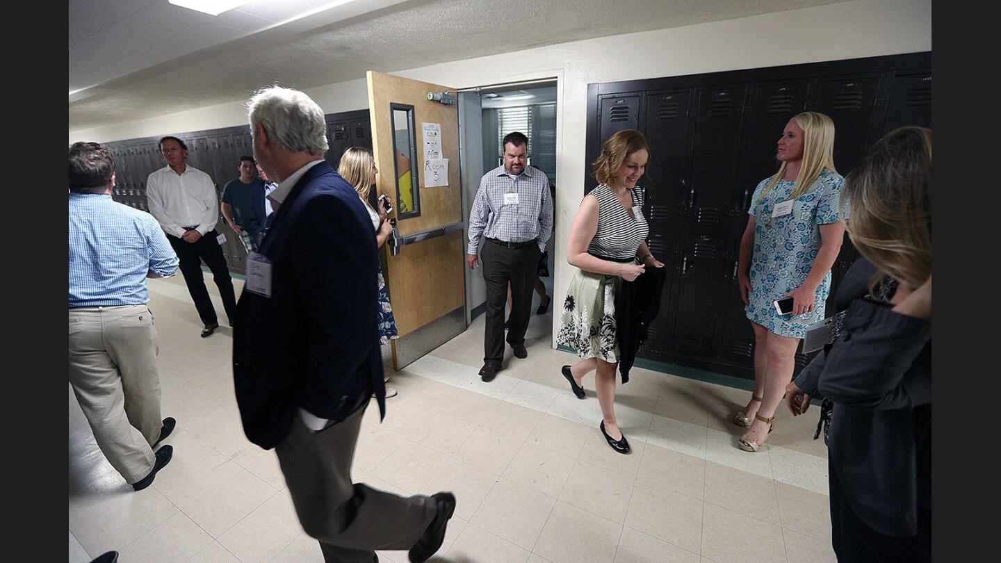 Tour members leave a classroom they just toured at Luther Burbank Middle School on Thursday, July 13, 2017. The Burbank Community YMCA, for the last four years, has hosted the Learn, Grow, Thrive program for children offering summer reading and enrichment. The program has teachers, primarily from the Burbank Unified School District, but has grown a lot requiring an outreach to nearby school districts, attracting a lot of teachers.