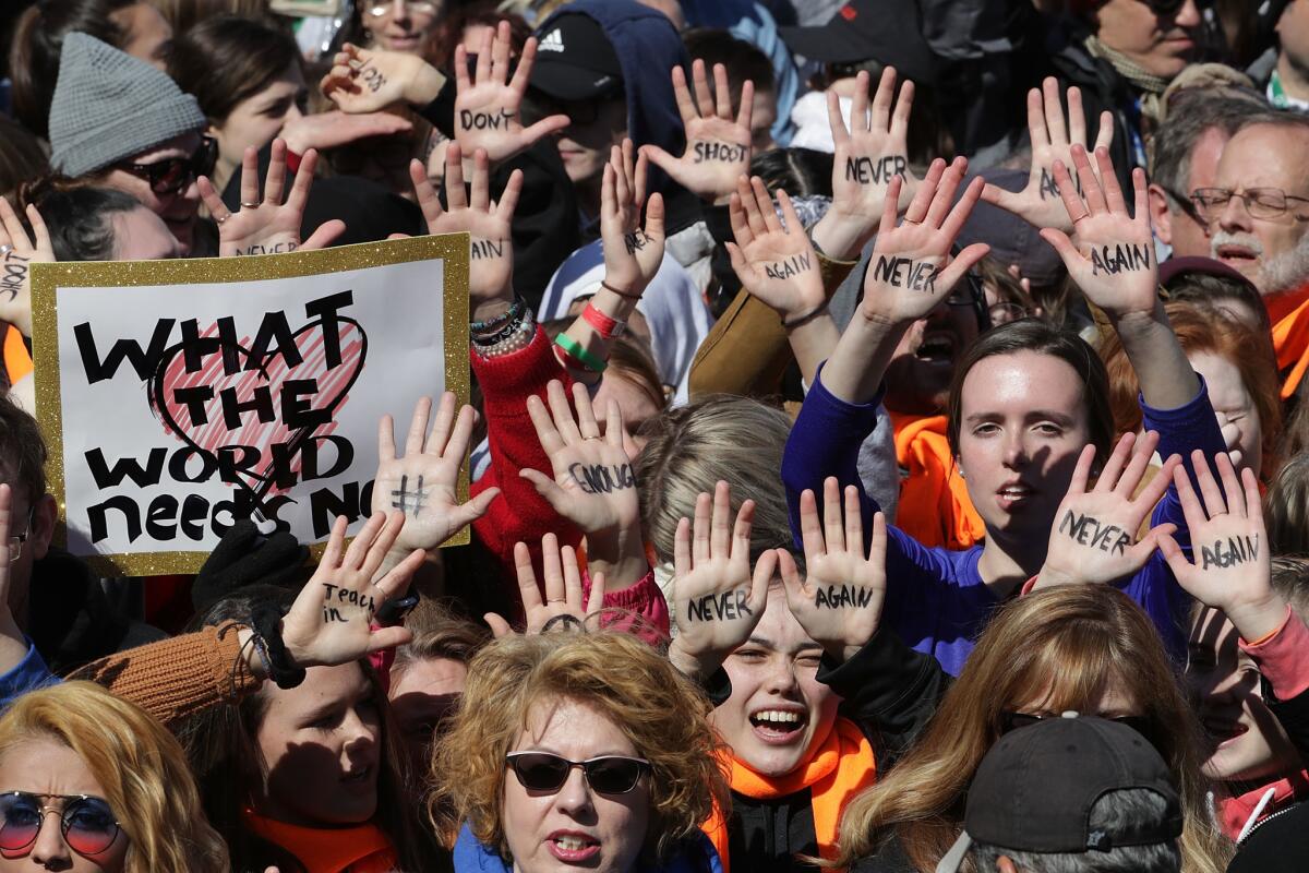 WASHINGTON: Protesters wrote messages on their hands such as "Never Again" and "Don't Shoot."