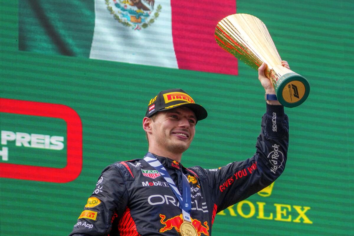 Red Bull driver Max Verstappen celebrates with the trophy on the podium after winning the Austrian Grand Prix on Sunday.