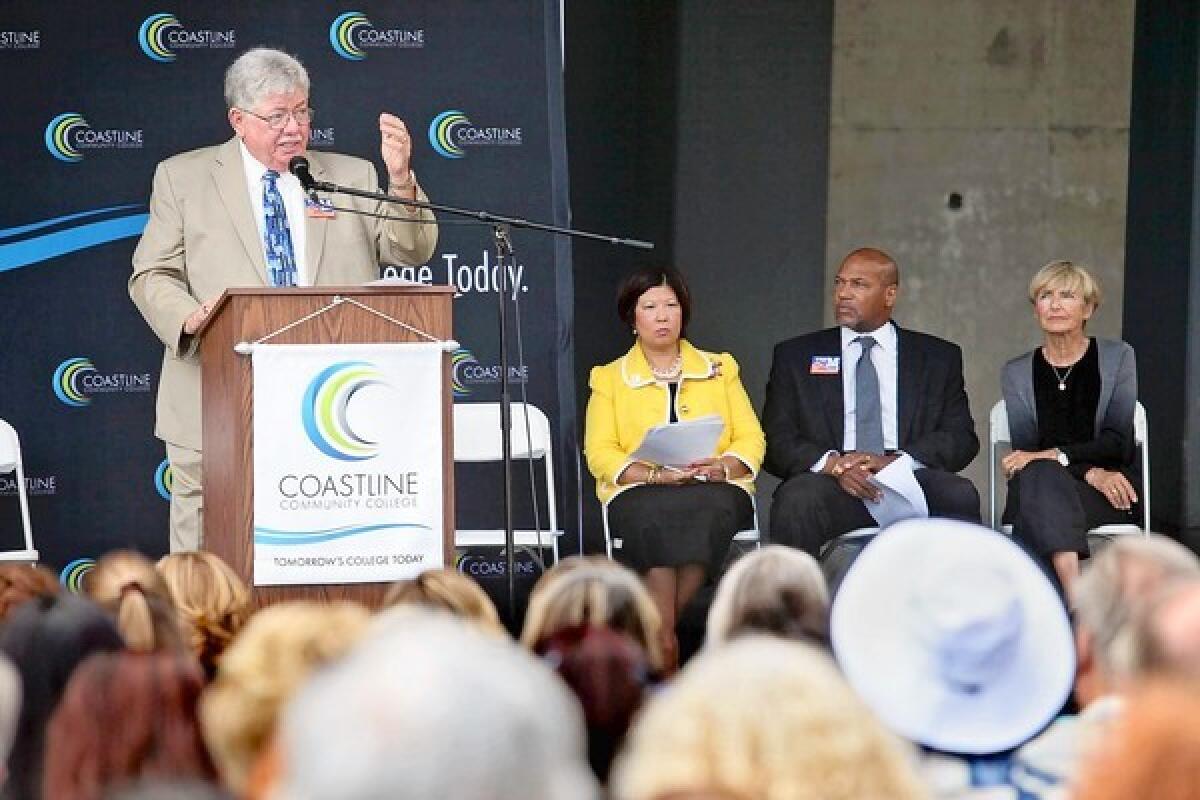 Jim Moreno, left, president of CCCD Board of Trustees, speaks during a ribbon-cutting ceremony.