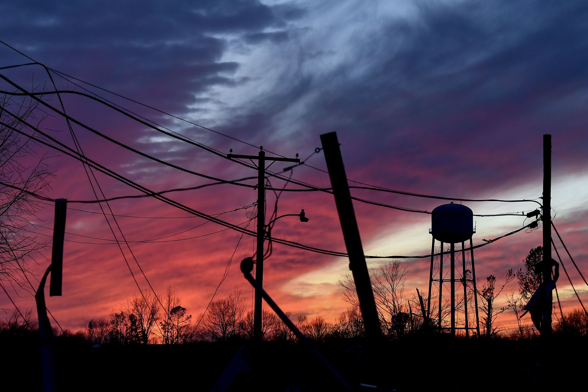 The sun sets over tornado damage in Dresden, Tenn.