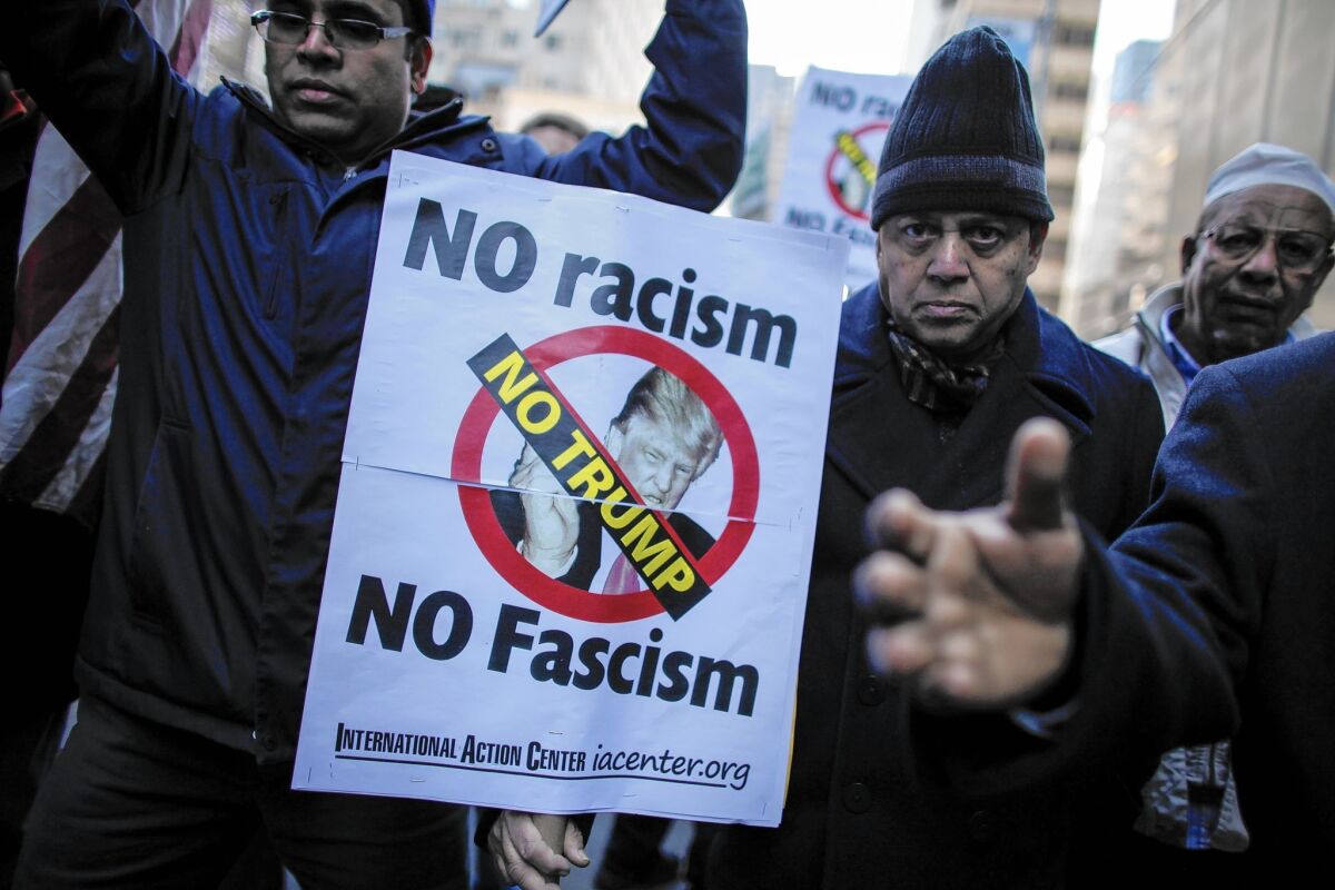 Muslims rally at Trump Tower in New York after he called for a temporary U.S. immigration ban. “We have a long strain in our political DNA of fearing people who are different,” says author Kenneth C. Davis.