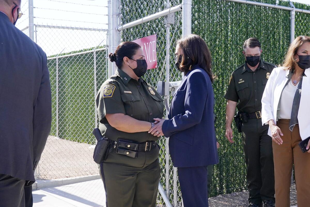 Kamala Harris talks to Gloria Chavez, chief patrol agent of the El Paso sector, at a U.S. border site 