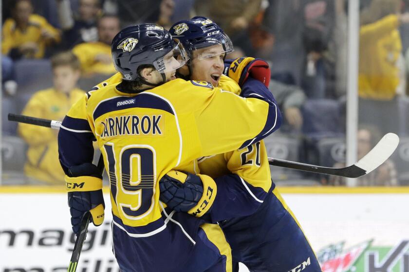 Nashville Predators forward Miikka Salomaki celebrates with Calle Jarnkrok (19) after scoring a goal against the Ducks during the second period of a game on Nov. 17.