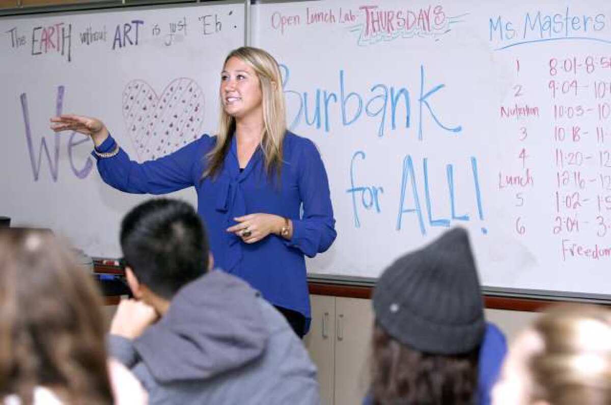 Burroughs High School art teacher Lauren Masters talks to her class about different types of art during class at the Burbank school on Friday, November 30, 2012. Masters, a first-year teacher, recently won a grant from Burbank Arts For All and she was able to purchase materials including a high-end painting drying rack.