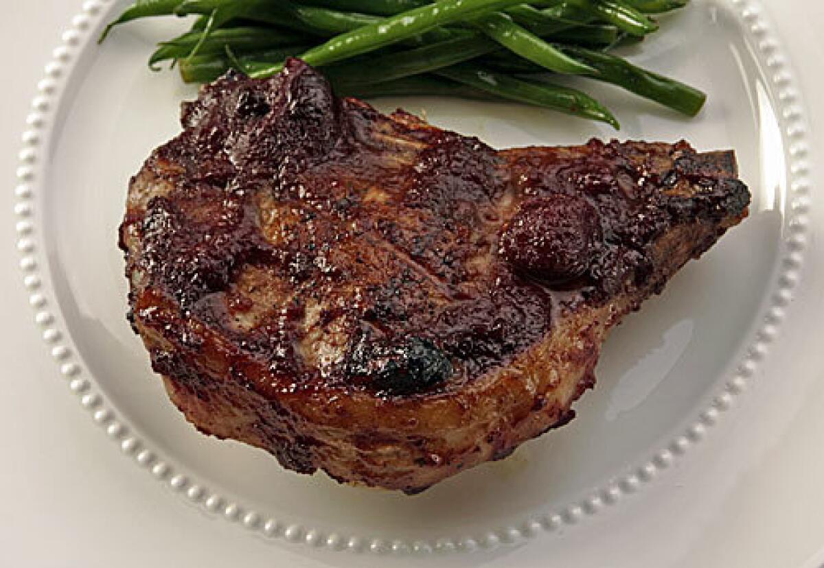 Stuffed pork chops with roasted cherry barbecue sauce.