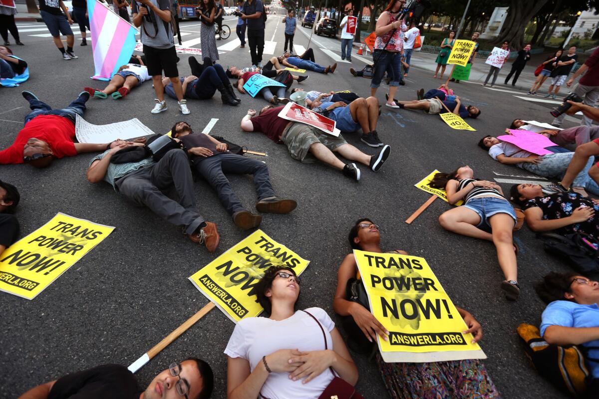 LGBT activists and community leaders lie in the intersection of 1st and Main streets in August to protest violence against transgender and "gender-non-conforming'' people.