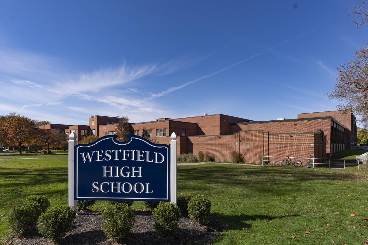 A sign in front of a brick building complex reads "Westfield High School."