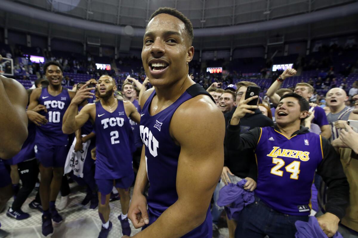 Texas Christian guard Desmond Bane, center, celebrates with teammates and fans following a win over Texas Tech in January.