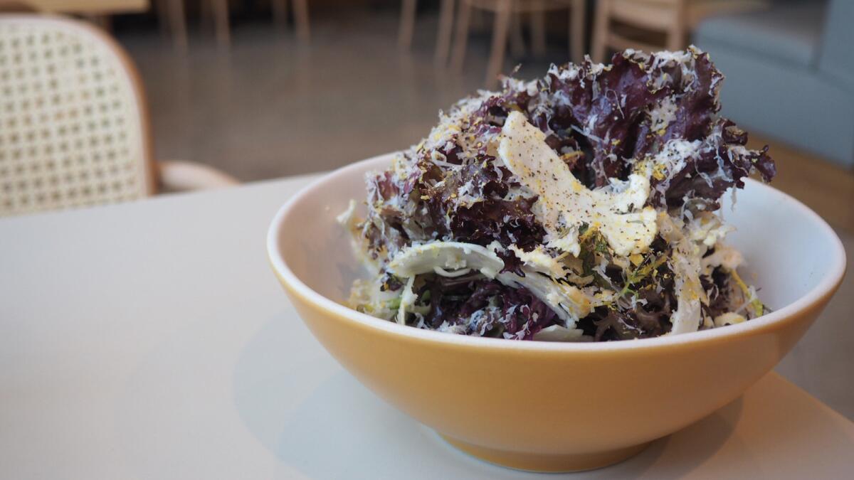 Shaved cauliflower salad with mustard frills, Lola Rosa, lime, Parmesan, Braggs, toasted cauliflower and sprouts from Wisome at the Elysian in Echo Park.